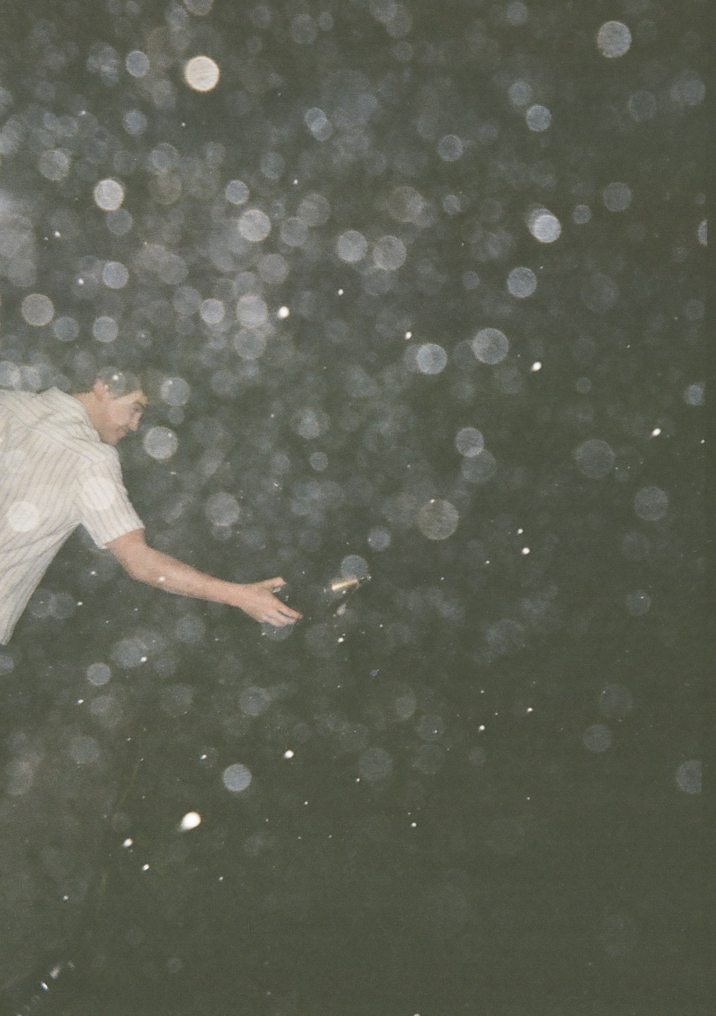 man holds an open champagne bottle