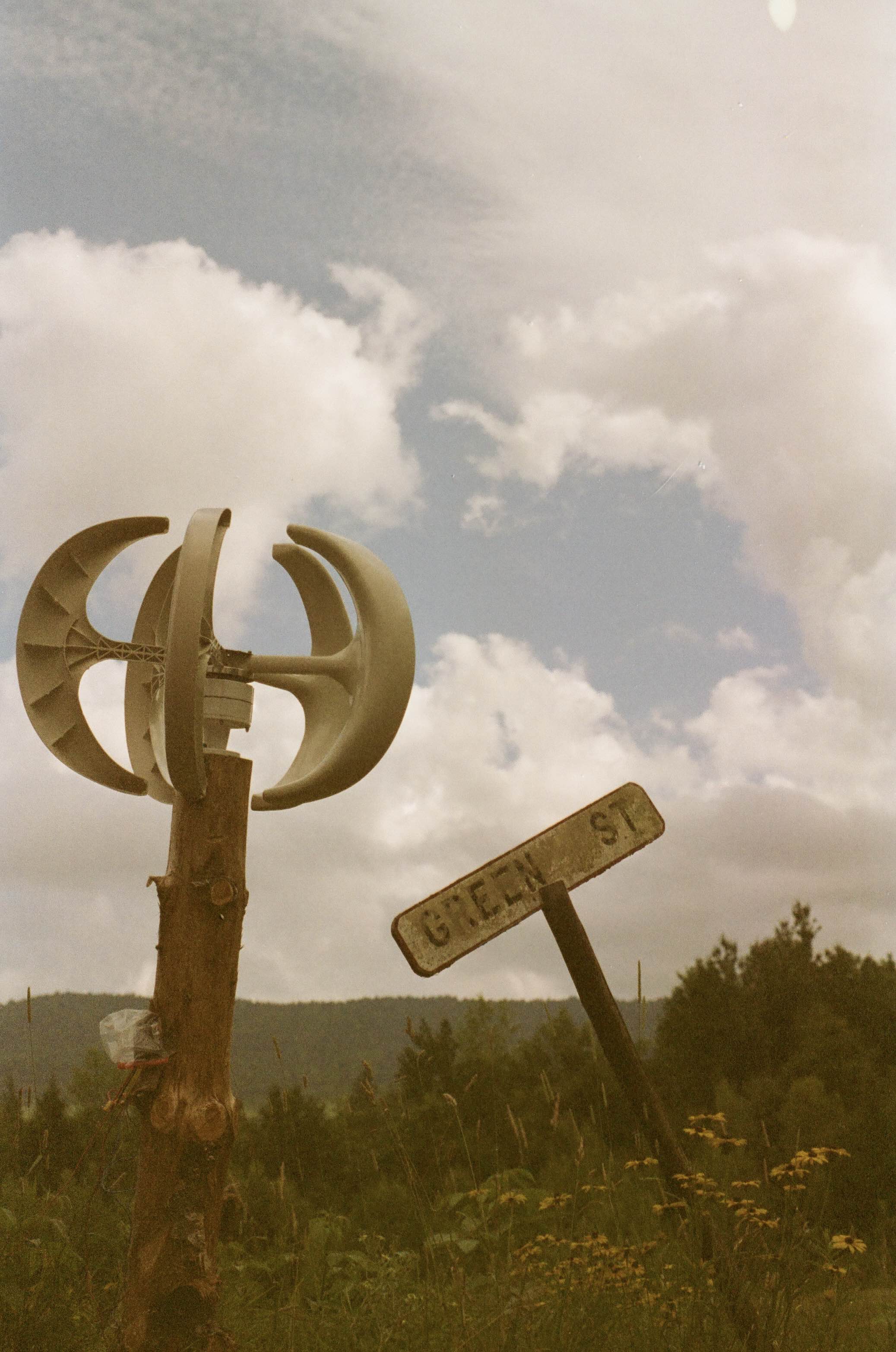 small wind turbine on green street