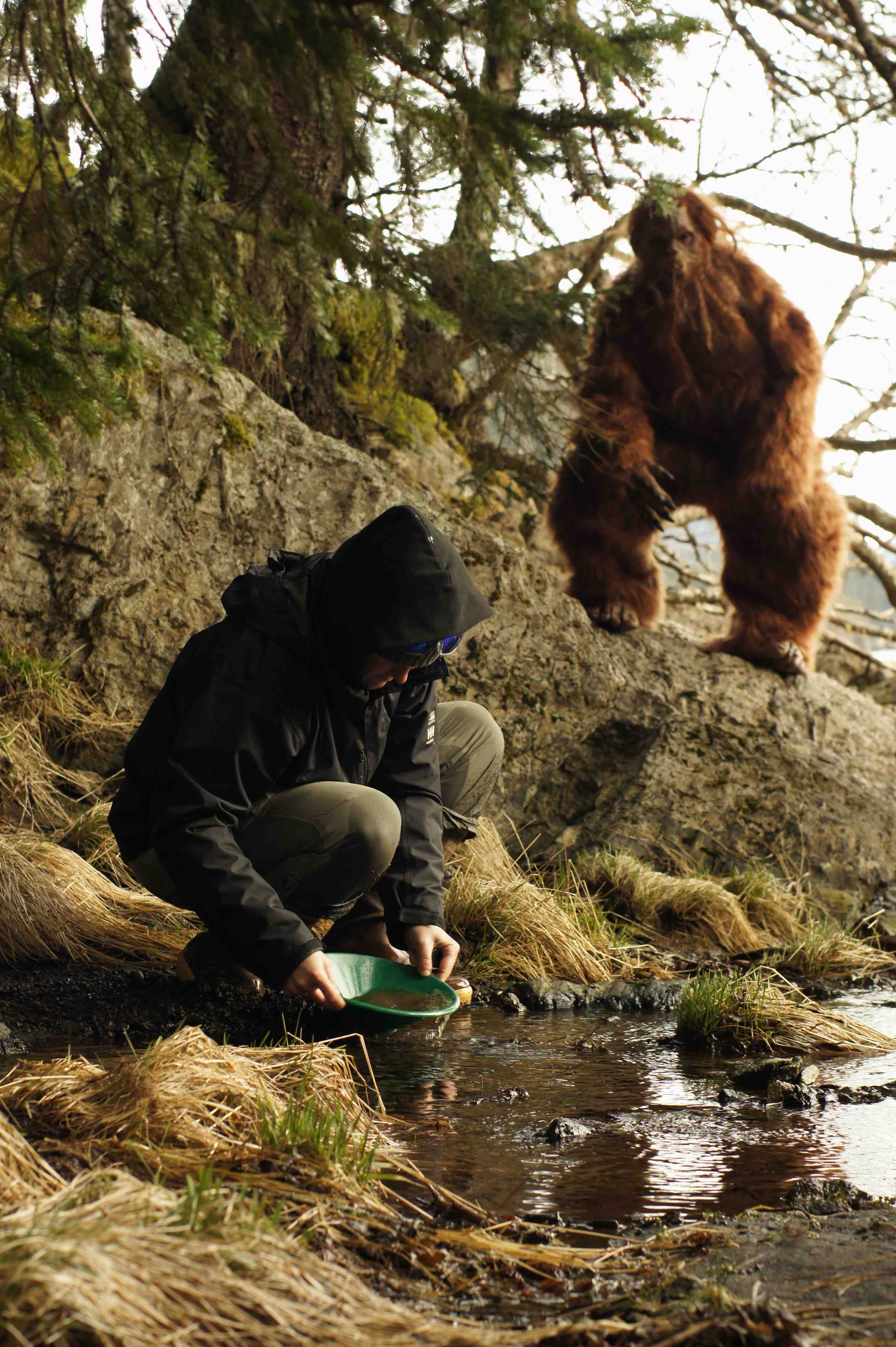Sasquatch observes a gold panner