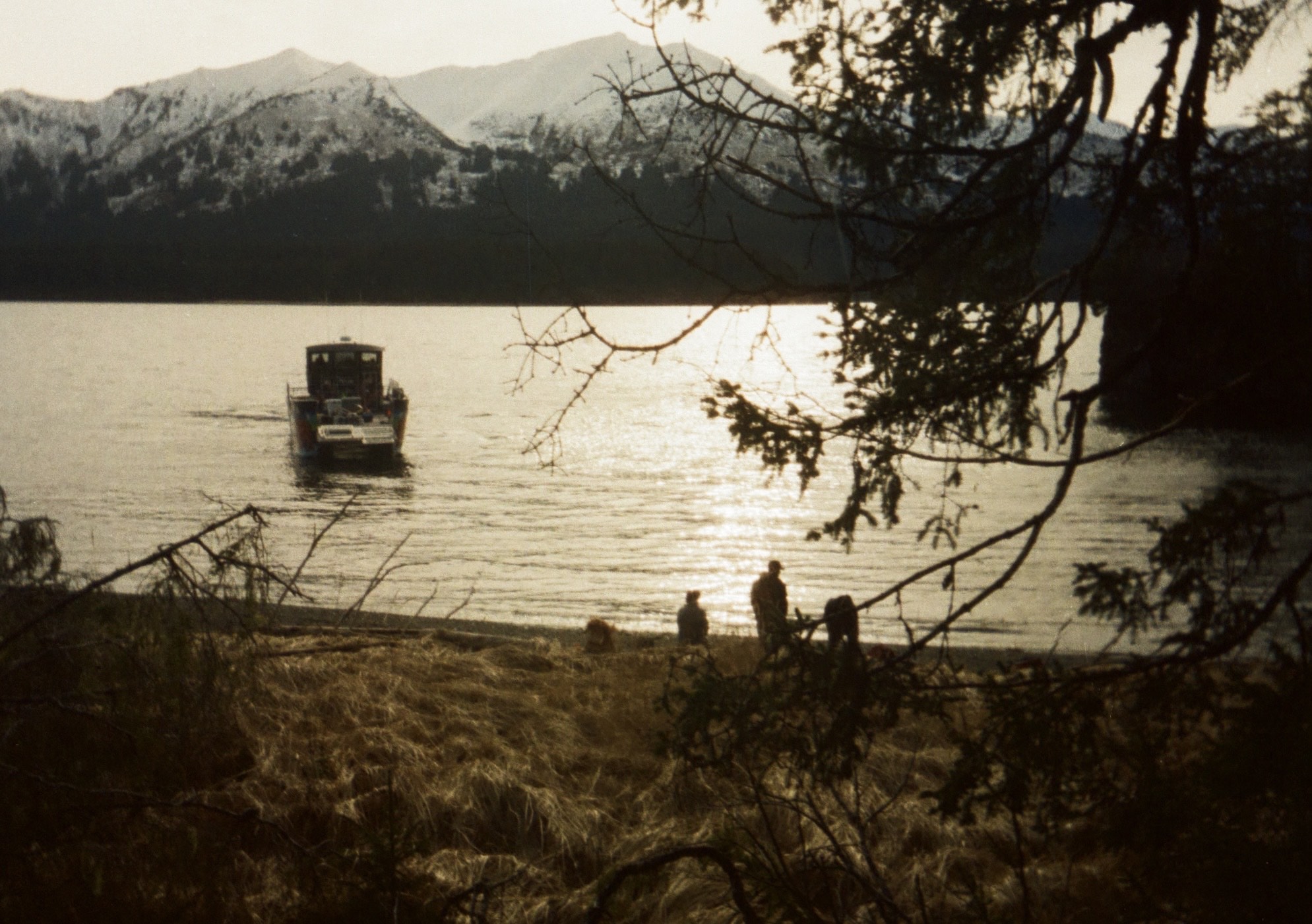 campers sit on a beach