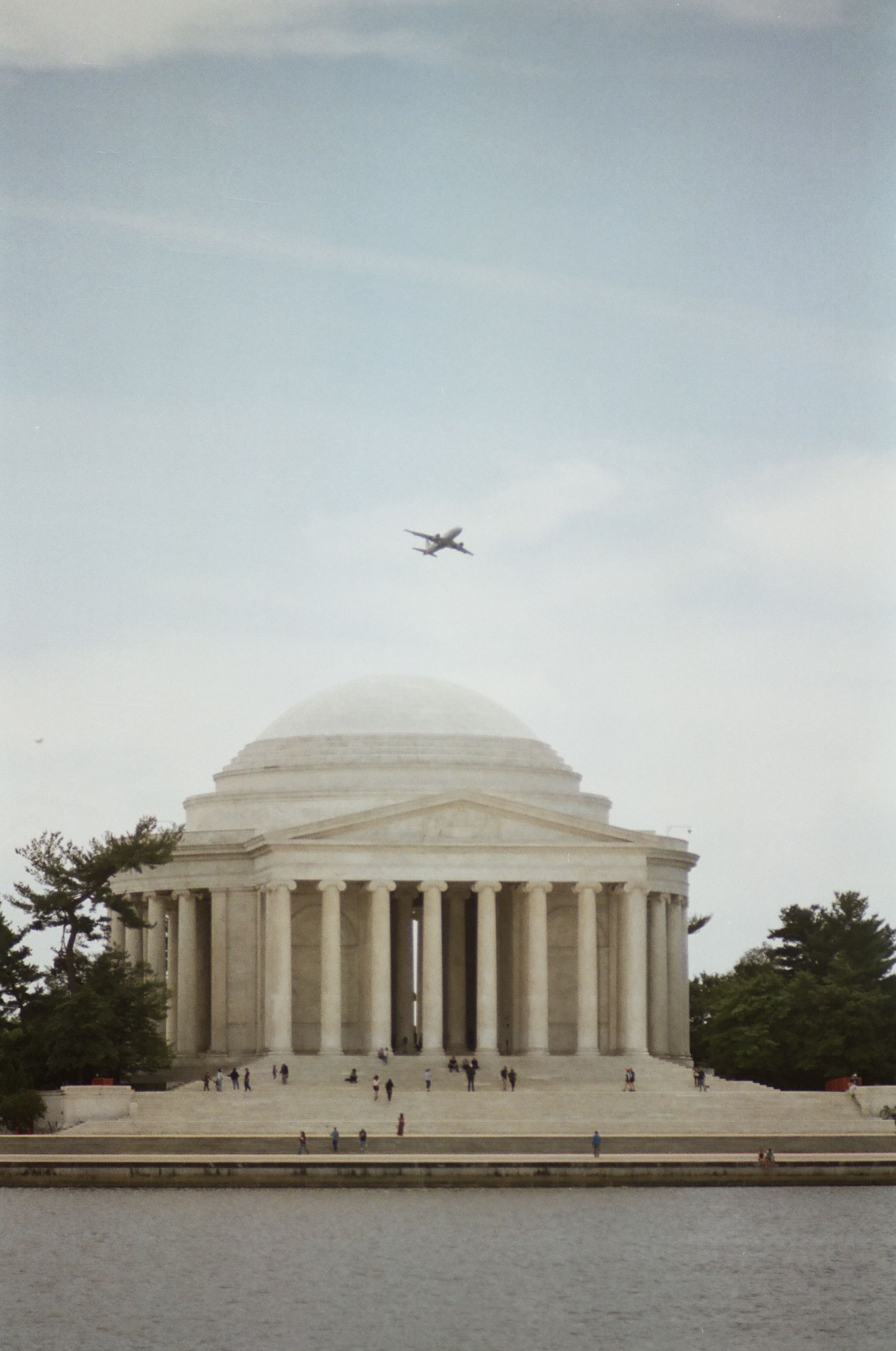 plane flies over Jefferson Monument
