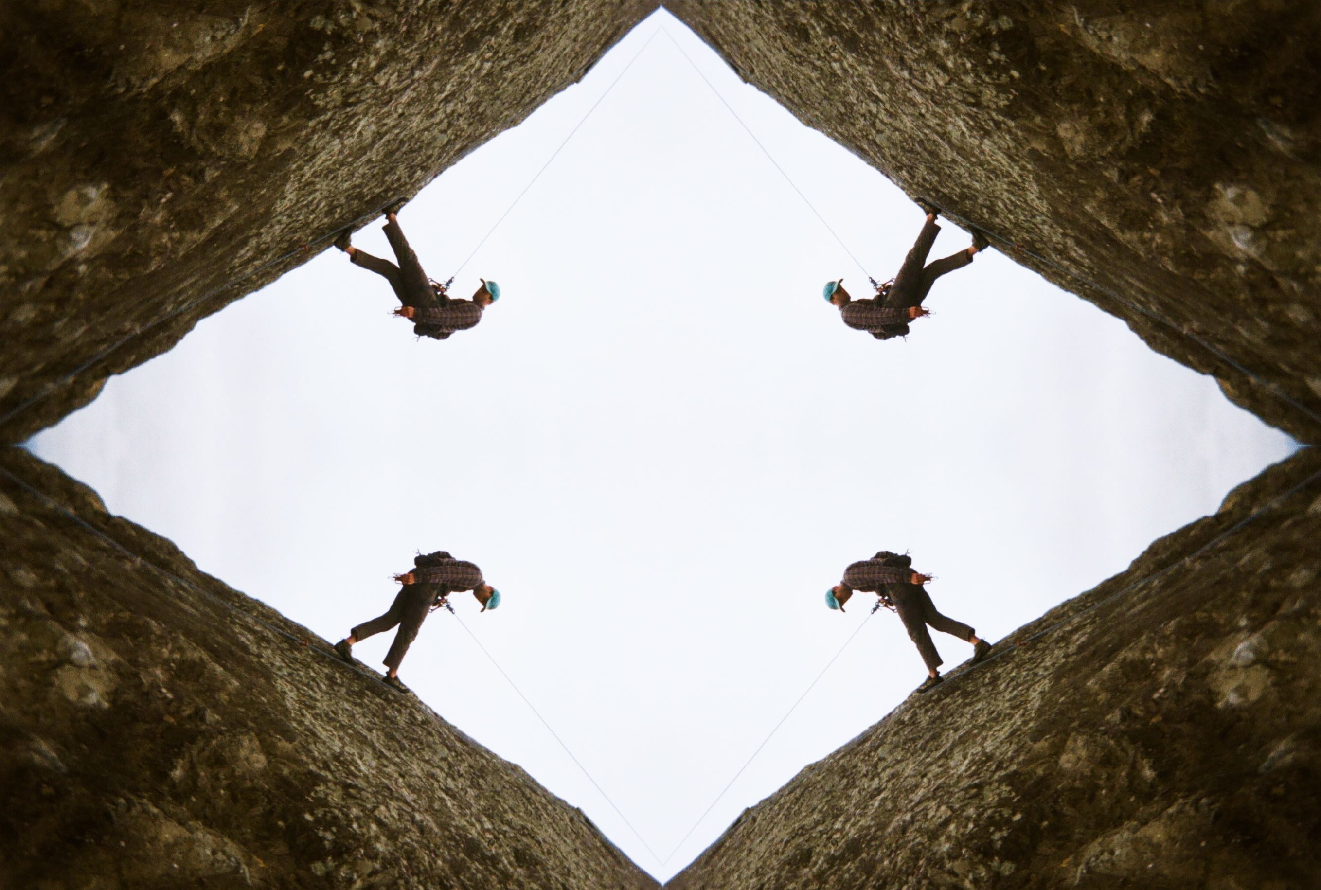4 climbers descend each corner